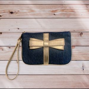 Small Dark Blue Wristlet With A Gold Bow In The Middle